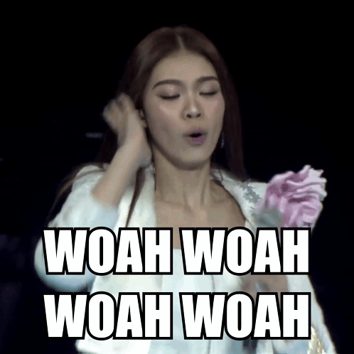 A Woman In A White Jacket Is Holding A Pink Flower And The Words Woah Woah Woah Woah Are Above Her GIF