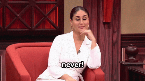 A Woman In A White Jacket Is Sitting In A Red Chair And Says " Never " GIF