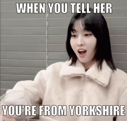 A Woman In A White Jacket With A Meme That Says When You Tell Her You 'Re From Yorkshire GIF