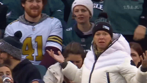 A Woman In A White Jacket With The Number 41 On Her Sleeve GIF