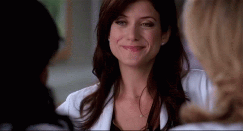Woman In Lab Coat Smiling And Talking GIF