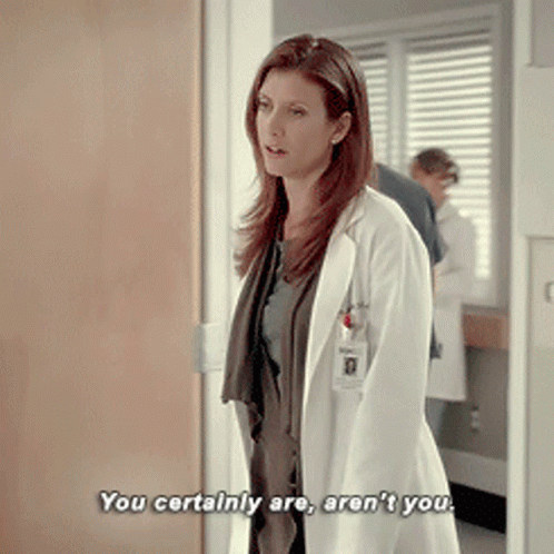a woman in a white lab coat says " you certainly are aren 't you "