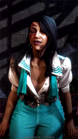 A Woman In A White Shirt And Blue Pants Is Sitting On A Bench GIF