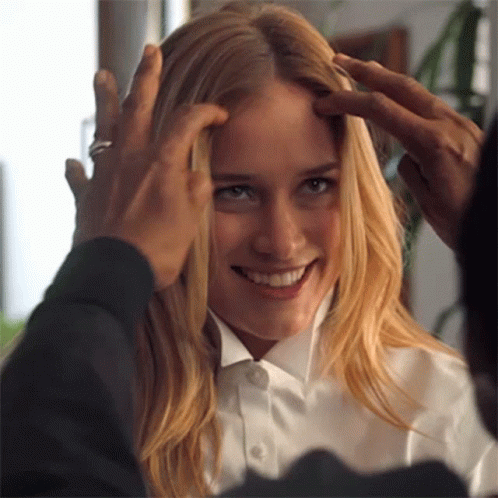 A Woman In A White Shirt Is Being Touched By A Man In A Black Shirt GIF