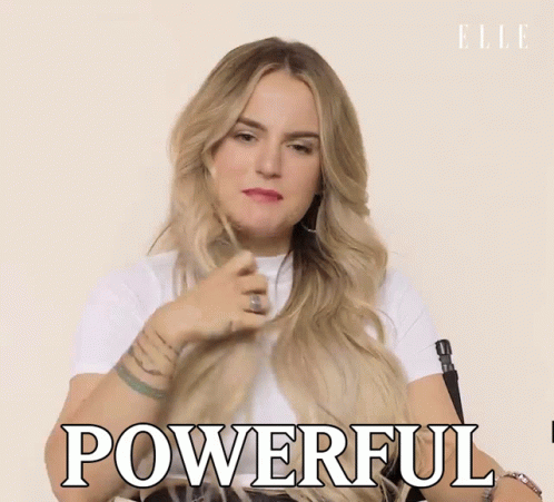A Woman In A White Shirt Is Holding Her Hair And Says Powerful GIF