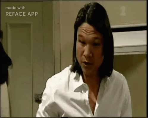 A Woman In A White Shirt Is Making A Funny Face And Is Made With Reface App GIF