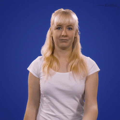 A Woman In A White Shirt Is Standing In Front Of A Blue Background That Says " Enew " GIF