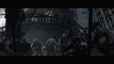 A Woman In A White Shirt Is Standing On A Ship GIF