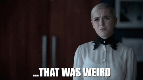 A Woman In A White Shirt With A Black Collar Says That Was Weird GIF