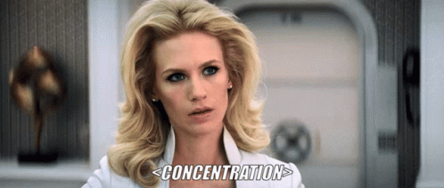 A Woman In A White Shirt With The Word Concentration Written Below Her GIF