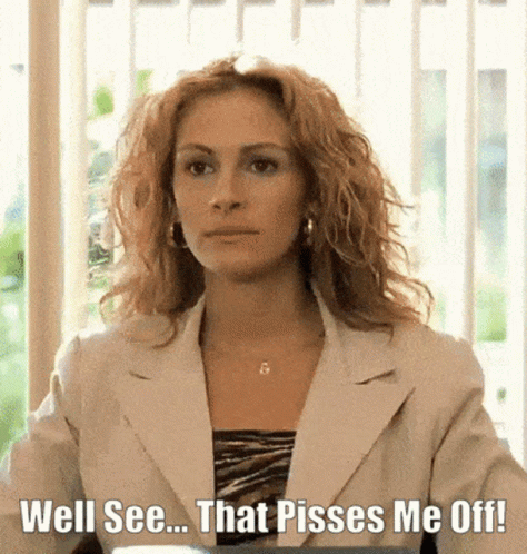 A Woman In A White Suit Is Sitting In Front Of A Window With The Words `` Well See ... That Pisses Me Off ! '' GIF