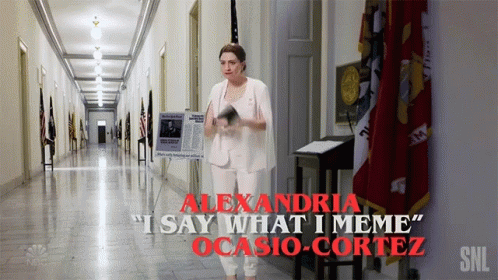 A Woman In A White Suit Is Standing In A Hallway With The Words Alexandria I Say What I Meme Ocasio Cortez GIF