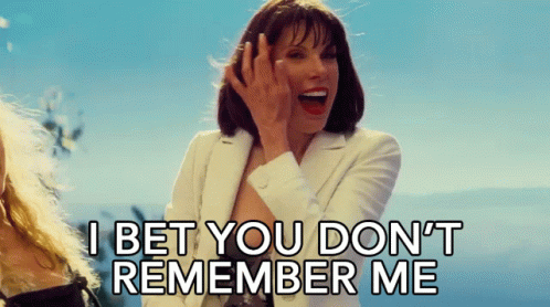 A Woman In A White Suit Says I Bet You Don 'T Remember Me GIF