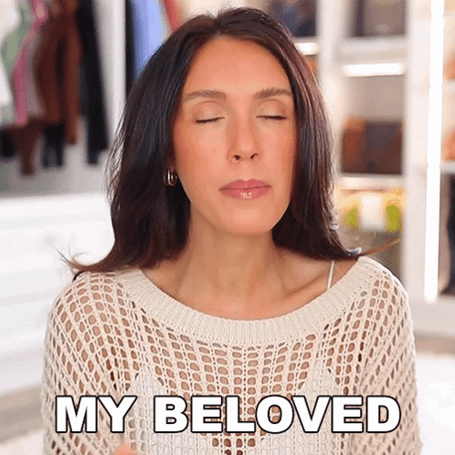 A Woman In A White Sweater Is Saying My Beloved GIF