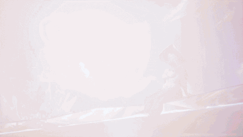A Woman In A White Swimsuit And Hat Is Sitting In A Pool Of Water GIF