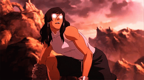 A Woman In A White Tank Top Is Kneeling Down In Front Of Mountains GIF