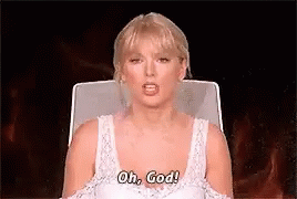 a woman in a white tank top is sitting in a chair and saying oh , god !