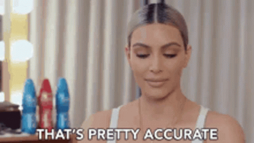 A Woman In A White Tank Top Is Sitting In Front Of A Mirror And Saying That 'S Pretty Accurate . GIF