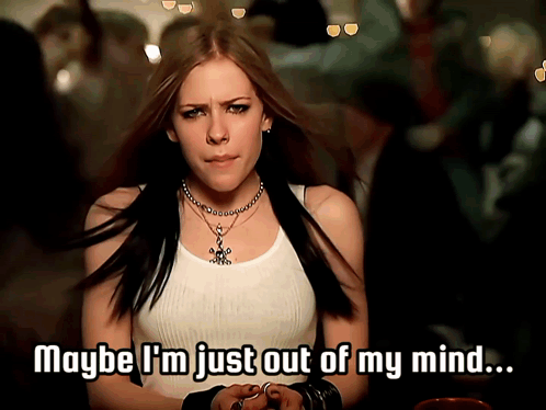 A Woman In A White Tank Top With The Words Maybe I 'M Just Out Of My Mind GIF