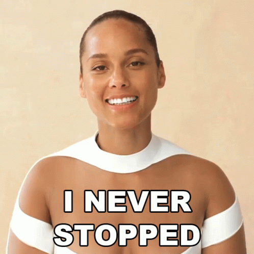A Woman In A White Top With The Words " I Never Stopped " Written On Her Chest GIF