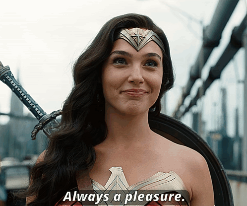 A Woman In A Wonder Woman Costume Is Smiling With The Words Always A Pleasure Underneath Her GIF