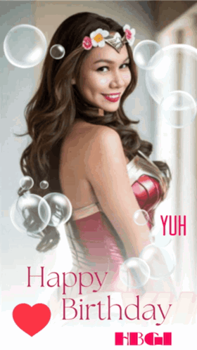 A Woman In A Wonder Woman Costume Is Surrounded By Bubbles And Says Happy Birthday GIF