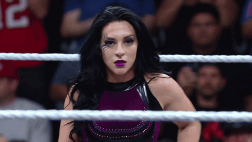 A Woman In A Wrestling Ring With A Jersey That Says 32 On It GIF