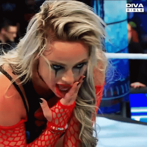 A Woman In A Wrestling Ring With Diva Bible On The Bottom GIF