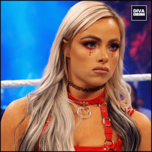 A Woman In A Wrestling Ring With The Diva Girls Logo GIF