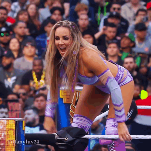 A Woman In A Wrestling Ring With The Name Tiffanyluv24 On The Bottom Right GIF