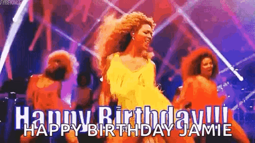 A Woman In A Yellow Dress Is Dancing On A Stage In Front Of A Group Of People . GIF