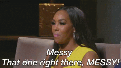A Woman In A Yellow Dress Is Sitting On A Couch And Says Messy That One Right There Messy . GIF