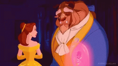 A Woman In A Yellow Dress Is Standing Next To A Man In A Blue Suit . GIF