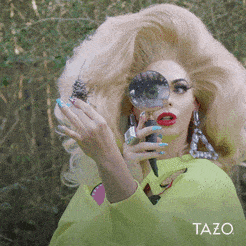 A Woman In A Yellow Jacket Is Holding A Magnifying Glass In Her Hand .. GIF