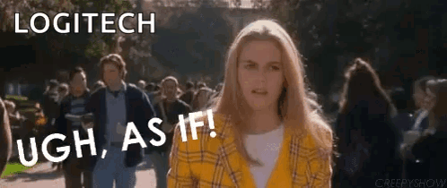 A Woman In A Yellow Plaid Shirt Is Standing In Front Of A Crowd Of People . GIF