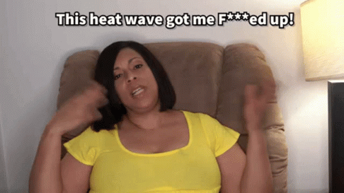 A Woman In A Yellow Shirt Is Sitting On A Couch With The Words This Heat Wave Got Me F *** Ed Up GIF