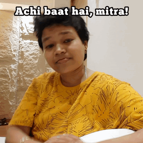 A Woman In A Yellow Shirt With The Words Achi Baat Hai Mitra GIF