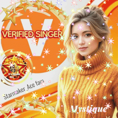 A Woman In A Yellow Sweater Stands In Front Of A Verified Singer Sign GIF