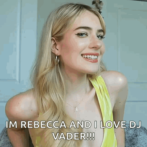 A Woman In A Yellow Top Is Smiling And Says Im Rebecca And I Love Dj Vader GIF