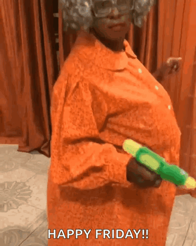 A Woman In An Orange Dress Is Holding A Green Water Gun And Says Happy Friday . GIF