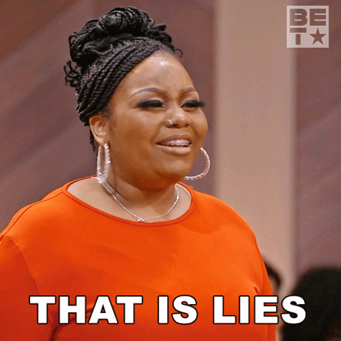 A Woman In An Orange Shirt With The Words That Is Lies On The Bottom GIF