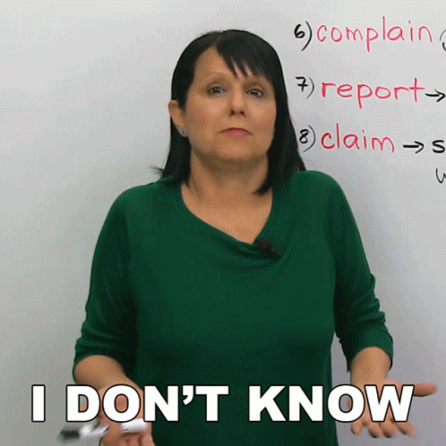 A Woman In Front Of A White Board Says I Don T Know GIF