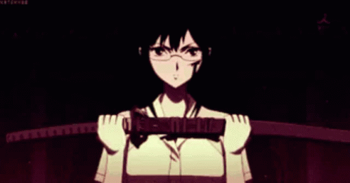 A Woman In Glasses Is Holding A Sword In Her Hands . GIF