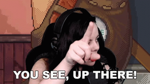 A Woman In Headphones Giving A Thumbs Up With The Words You See Up There Below Her GIF