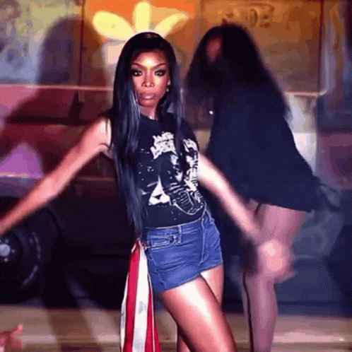 Woman In Shorts And Black Shirt Dancing GIF