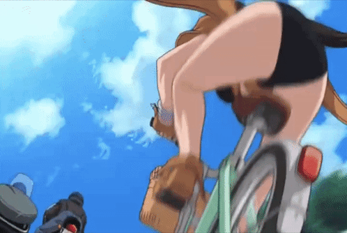 A Woman In Shorts Is Riding A Bike With A Backpack On Her Back GIF