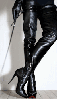 A Woman In Thigh High Boots Holds A Whip In Her Hand GIF