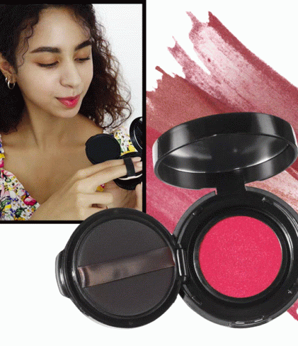A Woman Is Applying Lipstick To Her Lips Next To A Container Of Lipstick GIF