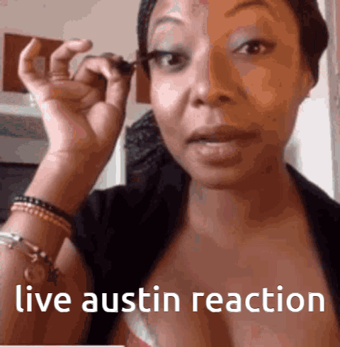 Woman Applying Mascara With Live Austin Reaction GIF