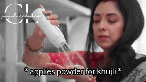 A Woman Is Applying Powder To Her Hand With The Caption " Applies Powder For Khuji " GIF